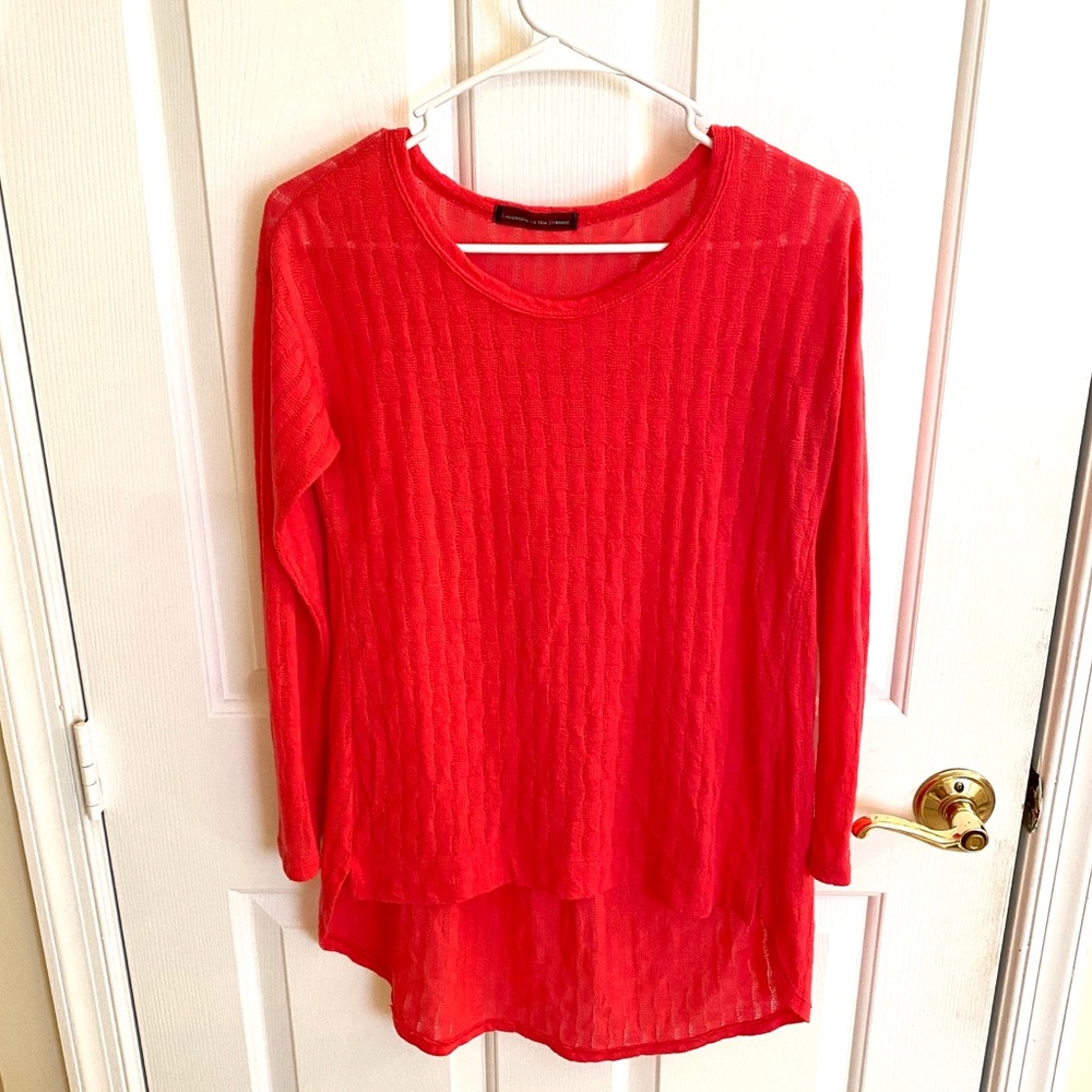Pinkish orange long sleeve high-low style. Size S